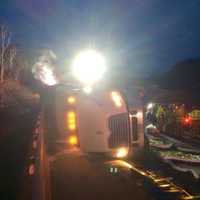 <p>A tractor-trailer carrying 5,000 live chickens rolled over on eastbound I-84 near Exit 13 in Southbury on Saturday morning.</p>