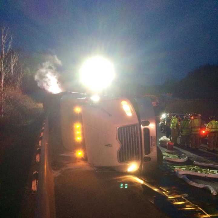 A tractor-trailer carrying 5,000 live chickens rolled over on eastbound I-84 near Exit 13 in Southbury on Saturday morning.