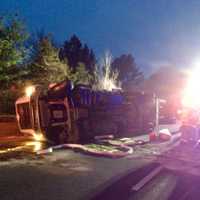 <p>A tractor-trailer carrying 5,000 live chickens rolled over on eastbound I-84 near Exit 13 in Southbury on Saturday morning.</p>