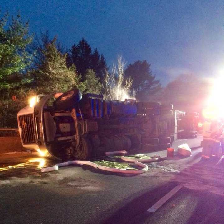 A tractor-trailer carrying 5,000 live chickens rolled over on eastbound I-84 near Exit 13 in Southbury on Saturday morning.