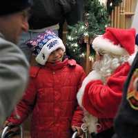 <p>Austin, 8 of Moonachie, was surprised by firefighters and Santa Claus on Saturday.</p>