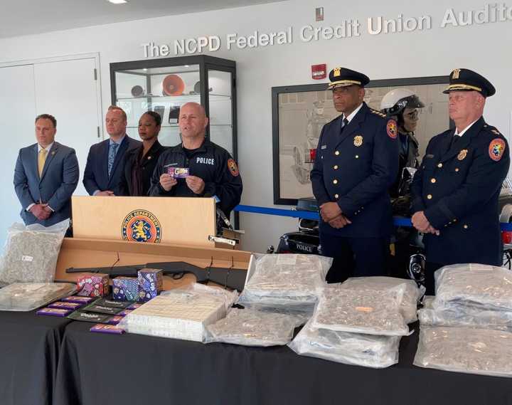 Police show the drugs and other items seized.