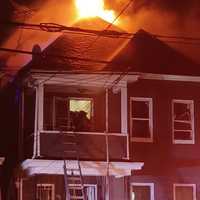 <p>Firefighters braved the flames but eventually had to withdraw about 45 minutes into the Harrison Street blaze in Passaic.</p>