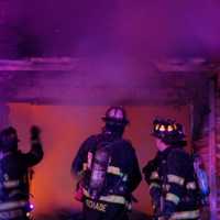 <p>Firefighters contained the Bogert Place blaze to the attached garage, with some damage to the exterior of the home.</p>