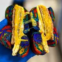 <p>Rainbow bagel with egg and cheese.</p>