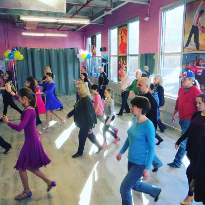 Dancers learn new moves at the  Ballroom Dance Sport Center.