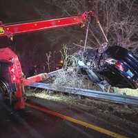 <p>The BMW SUV careened over a guardrail and into a ravine, landing on its roof, at the westbound ramp to Route 80 in Saddle Brook.</p>