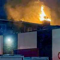 <p>Flames through the roof of the Atlantic Court Condos on State Street at Atlantic Street in Hackensack.</p>