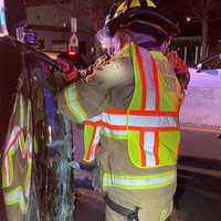 <p>Fair Lawn Rescue Squad members cut out the windshield to free pizza deliveryman.</p>