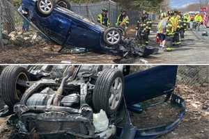 Sedan Lands Upside Down On Fence Off Route 208