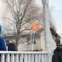 <p>Flames blew through the roof, collapsing part of it.</p>