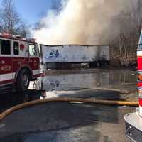 <p>Several tractor-trailers were on fire at a local plastics company.</p>