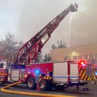 <p>Paterson firefighters kept water on the building well past daybreak on Sunday, May 22.</p>