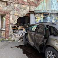 <p>The occupants bolted after the SUV struck Morningside Greenhouse in Haledon.</p>