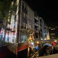 <p>Firefighters doused the flames, which had spread to the Arrive Fort Lee building from two Dumpsters ignited by fireworks.</p>