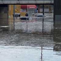 <p>Vehicles seen floating from the Elmwood Park side of Broadway.</p>