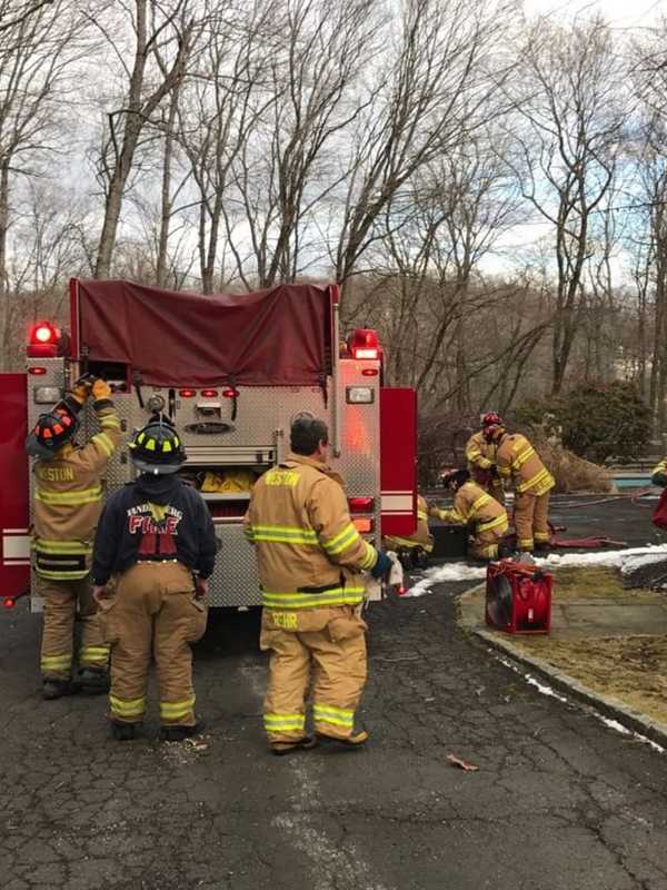 Weston Fire Department Quickly Douses Small Fire Behind House