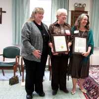 <p>Liz Feldman of the Town of Ossining, left, and Ossining Mayor Victoria Gearity, right, both presented the Dominican Sisters of Hope with proclamations for the Day of Hope in Ossining.</p>