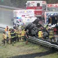 <p>The 29-year-old dump truck driver from Elmwood Park is loaded into an ambulance after the crash on northbound Route 287 in Mahwah.</p>