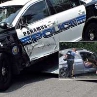 <p>This Paramus police cruiser, another and the pursued stolen BMW sedan were all towed from the scene just off Route 17.</p>