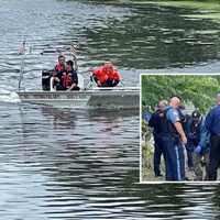 <p>Totowa fire boat in the Passaic River, recovery team on the shore.</p>