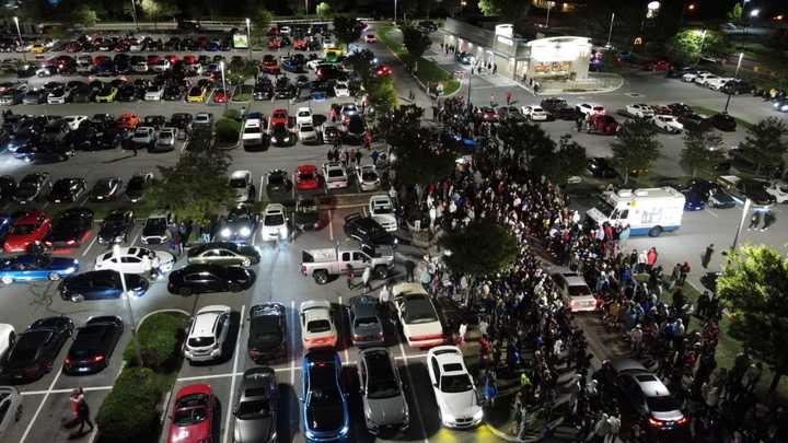 Cars gather in the Loew&#x27;s parking lot on Route 9 Friday evening.