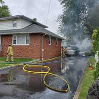 <p>Two vehicles were severely damaged in the Roosevelt Street garage fire in Little Ferry.</p>