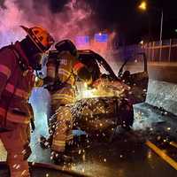 <p>Firefighters at the scene of stolen car chase crash on eastbound Route 3 in Rutherford.</p>