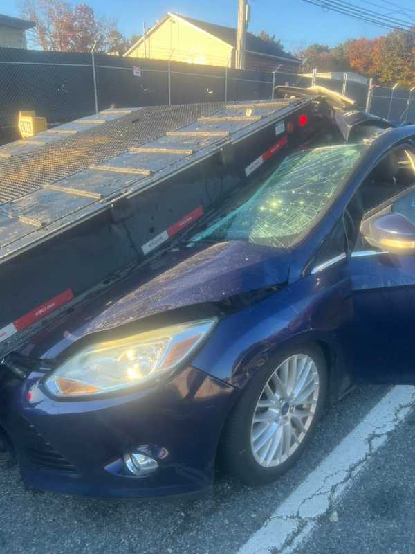 Close Call: Driver Avoids Injury After Crashing Under Rollback Truck In Joppa