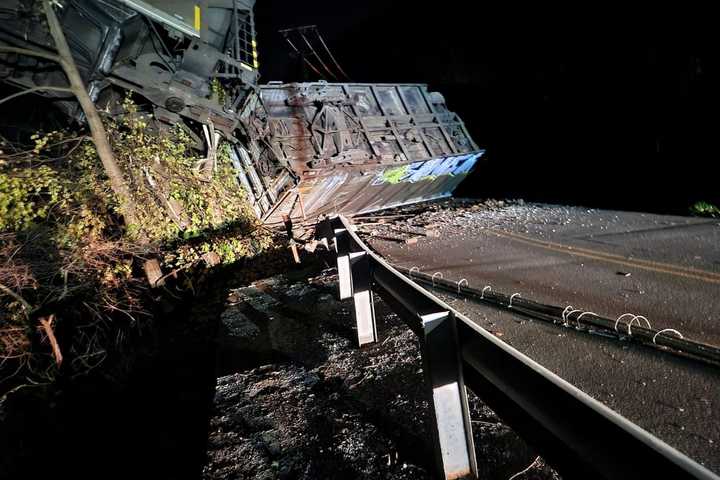 PHOTOS: Train Dangles Off Bridge Following Derailment In Central Pennsylvania