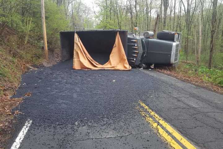 Dump Truck Overturns, Shutting Down Roadway In New City