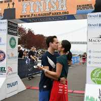 <p>Moments after crossing the finish line, Thomas Susarchick proposes to girlfriend Ariel Hidalgo at Rock the River Race in Fort Lee.</p>