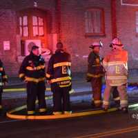 <p>Lawrence Fire Chief Moriarty and other firefighters.</p>