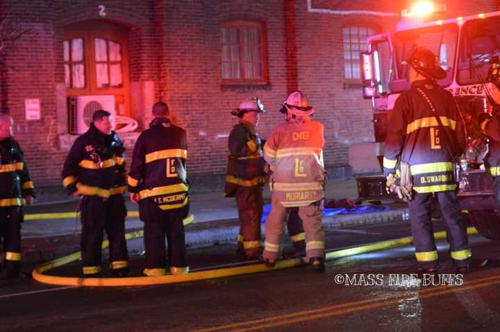 Lawrence Fire Chief Moriarty and other firefighters.