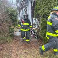 <p>A firefighter wearing a mask.</p>