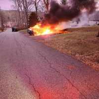 <p>A car engulfs into flames in Somers on Nymph Drive.</p>