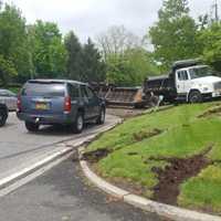 <p>A dump truck driver crashed his truck, blocking a major thruway for hours.</p>