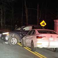 <p>One car rests on top of another after a crash in Cortlandt.</p>