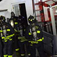 <p>A group of Everett firefighters at the affected home.</p>