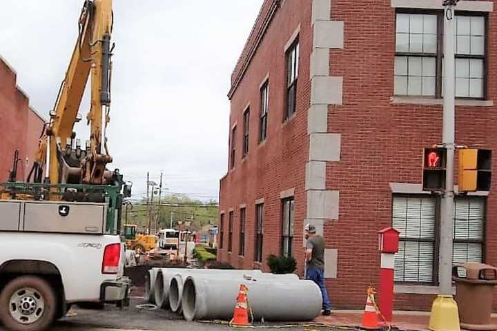 Man Injured When Backhoe Knocks Lamppost Into Hackensack Law Office Window
