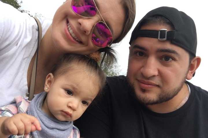 Cynthia and Bryan Castro with their daughter.