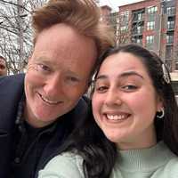 <p>Conan posing with store manager Rylan.</p>