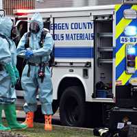 <p>A Bergen County Hazardous Materials Unit enters Bio-Reference Laboratories in Elmwood Park on Friday, March 31.</p>