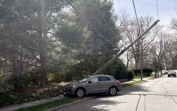 The Audi SUV shattered the utility pole on West End Avenue in Ridgewood around noon Saturday, April 8.