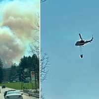 <p>Efforts continued to contain the fire off Route 23 in West Milford.</p>