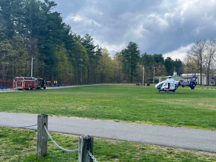 A medical helicopter lands at the scene of a head-on car crash in Pepperell on Wednesday, April 26