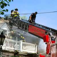 <p>The two-alarm blaze -- three bells for coverage -- ignited shortly before noon May 27 and quickly spread through the Lynn Drive home.</p>