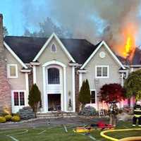 <p>The blaze in the two-story, 4,200-square-foot Carlough Road house in Upper Saddle River broke out around 8 p.m. May 27, bringing firefighters from both sides of the state line.</p>