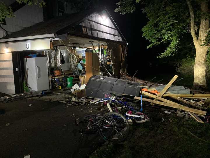 The home on Andrew Drive was hit by a van whose driver fled the scene.