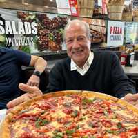 <p>Dan Grimaldi and his pizza pie at Chico &amp; Sons in Northfield.</p>